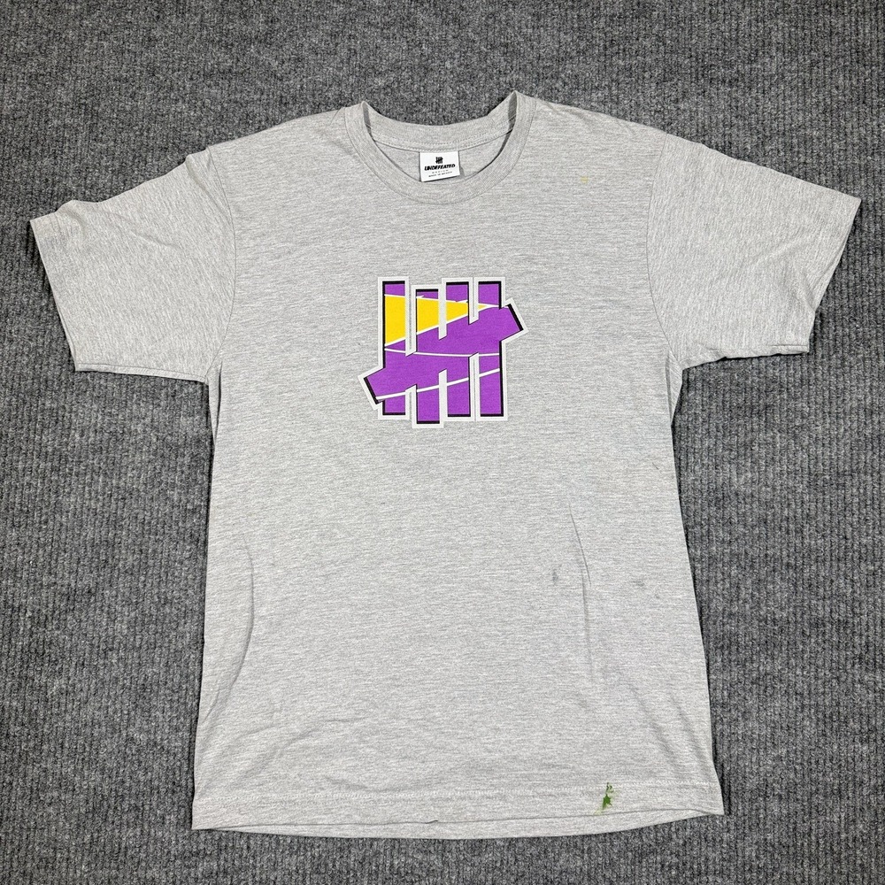 NWOT Undefeated Mens Graphic T-Shirt Heather Gray Purple Yellow Medium